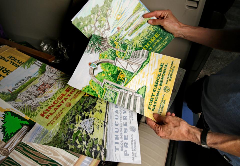 Kathy Stark holds copies of a number of the sites she has painted for her recent "See Jacksonville" project. Stark created a series of paintings paying homage to the stylized WPA era National Parks silkscreened posters dating from the 1930s. Her new work takes the iconic style but uses local parks and natural areas around greater Jacksonville as her subject matter.