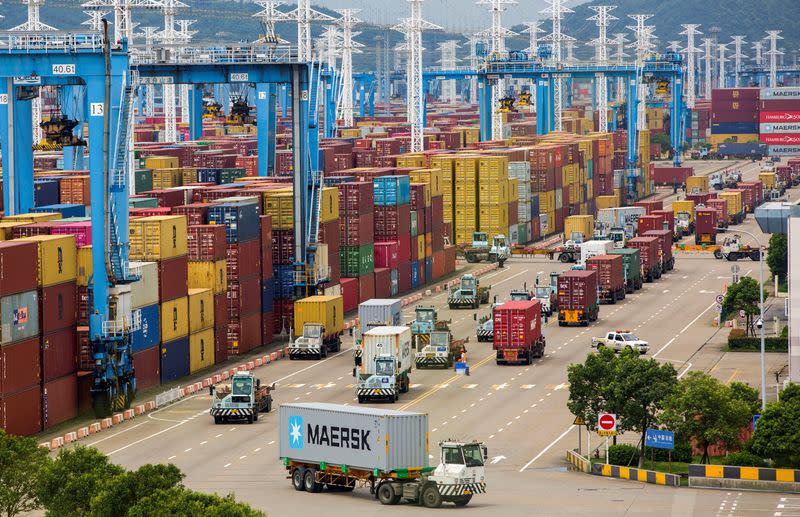 Lines of trucks are seen at a container terminal of Ningbo Zhoushan port