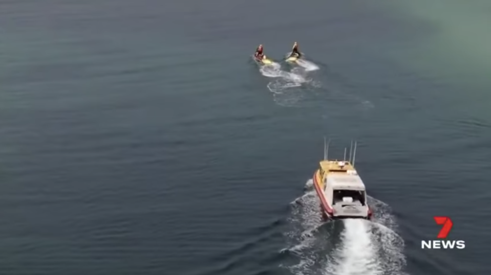 Search vessels look for missing surfer Andrew Sharpe at Kelps Beds along Wylie Bay.