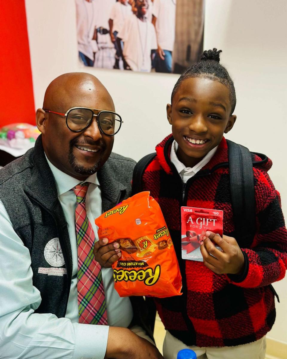 PHOTO: Calvin Jones delivers gifts to Principal Craig on National Principal's Day in 2023. (Courtesy Lenora Felder)