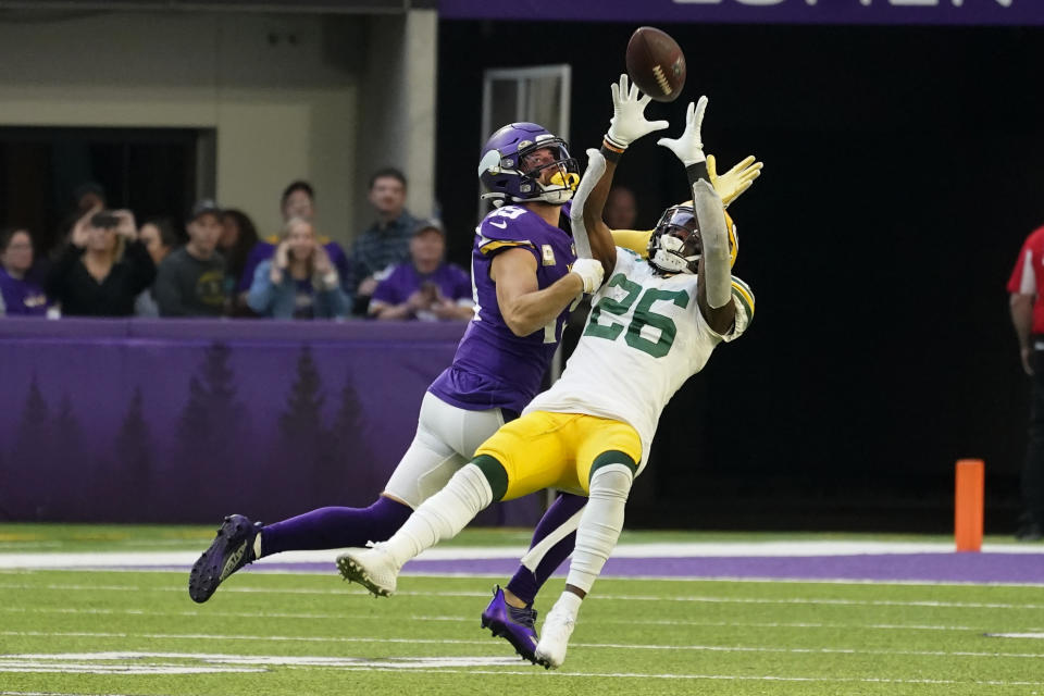 Green Bay Packers free safety Darnell Savage (26) breaks up a pass intended for Minnesota Vikings wide receiver Adam Thielen (19) during the second half of an NFL football game, Sunday, Nov. 21, 2021, in Minneapolis. (AP Photo/Jim Mone)