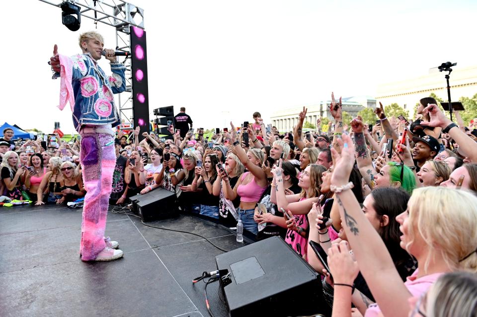 Machine Gun Kelly reacted to a fan jumping on stage during a recent Forbes event.