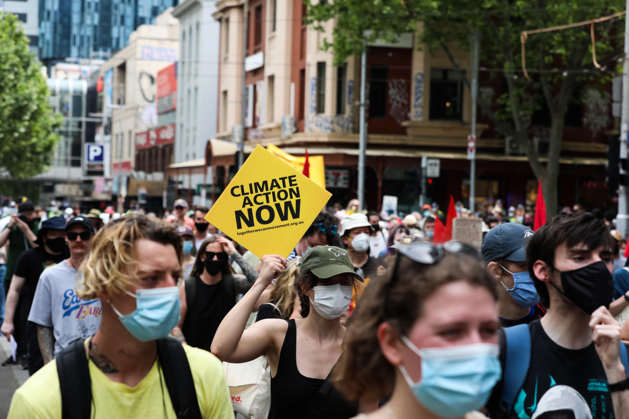 Climate change protesters carry placards at a march in Melbourne, Australia.