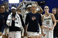 Indiana Fever guard Caitlin Clark (22) walks off the court with teammates after losing to the Connecticut Sun in a WNBA basketball game, Tuesday, May 14, 2024, in Uncasville, Conn. (AP Photo/Jessica Hill)
