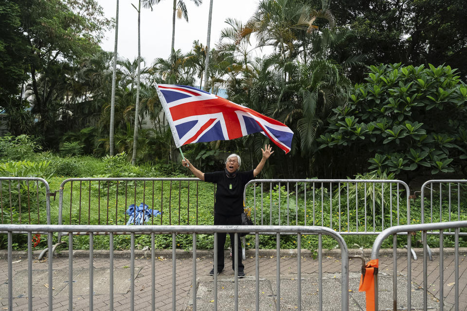 Activist Alexandra Wong, also known as Grandma Wong, holds a flag of Britain outside the West Kowloon Magistrates' Courts in Hong Kong, Thursday, May 30, 2024. (AP Photo/Chan Long Hei)