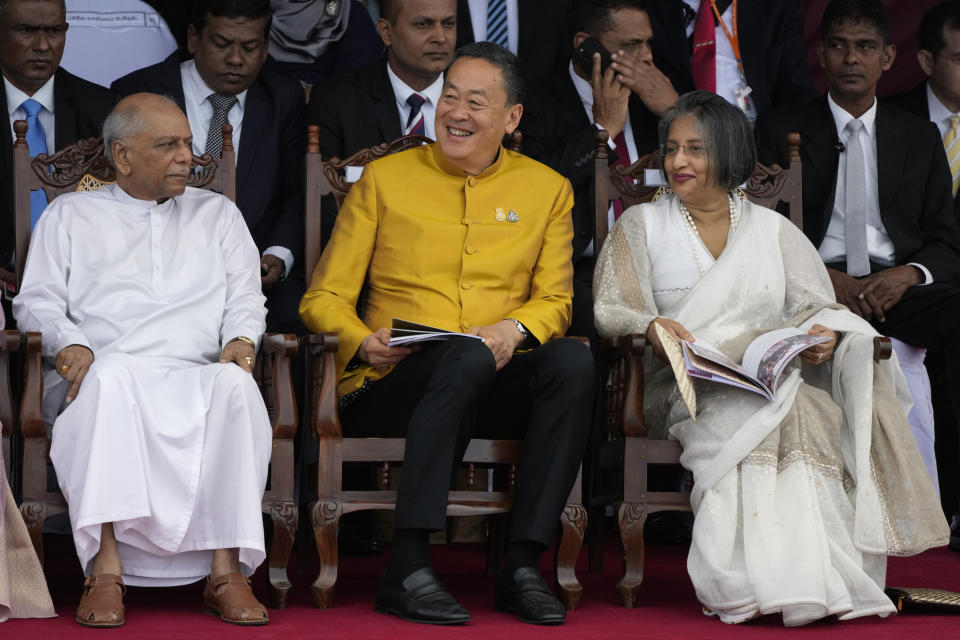 Thai Prime Minister Srettha Thavisin, center, sits with Sri Lankan Prime Minister Dinesh Gunawaradane, left, and the First Lady of Sri Lanka Maithree Wickremesinghe, during the 76th Independence Day commemoration ceremony of Sri Lanka in Colombo, Sri Lanka, Sunday, Feb. 4, 2024. (AP Photo/Eranga Jayawardena)