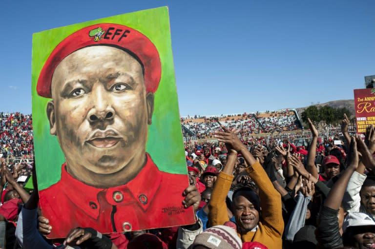 Supporters of the Economic Freedom Fighters (EFF), South Africa’s third-biggest party, hold a placard with the portrait of EFF leader Julius Malema