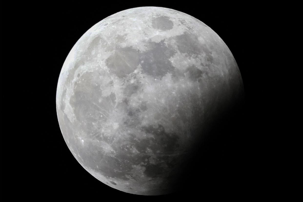  The full "Hunter's moon" is pictured during a partial lunar eclipse above Kuwait City on October 28, 2023. . 