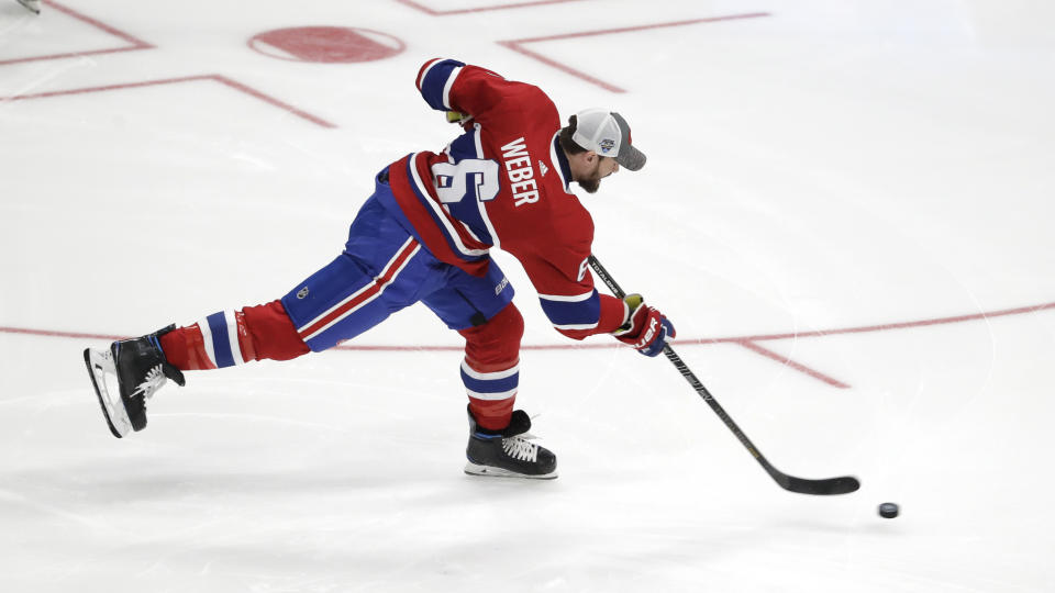 Montreal Canadiens' Shea Weber shoots during the Skills Competition hardest shot event, part of the NHL hockey All-Star weekend, Friday, Jan. 24, 2020, in St. Louis. Weber won the event. (AP Photo/Jeff Roberson)