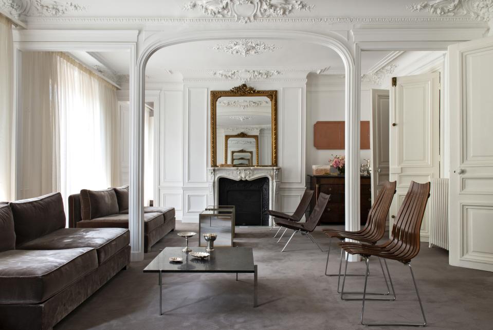 Another view of the main salon. The leather seating is by Danish designer Poul Kjaerholm. A work by the artist collective Reena Spaulings hangs nearby.