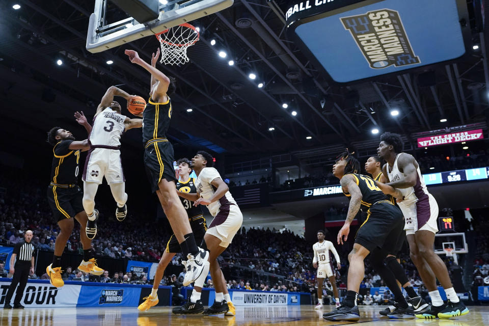 Mississippi State's Shakeel Moore (3) shoots against Pittsburgh's Nelly Cummings (0) during the first half of a First Four game in the NCAA men's college basketball tournament Tuesday, March 14, 2023, in Dayton, Ohio. (AP Photo/Darron Cummings)