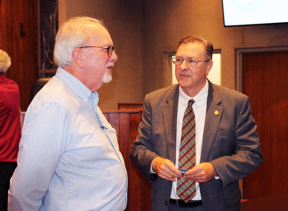 New Oak Ridge City Manager Randy Hemann, right, talks with Anderson County Chancellor Jaime Brooks after the City Council work session Thursday, Nov. 9.