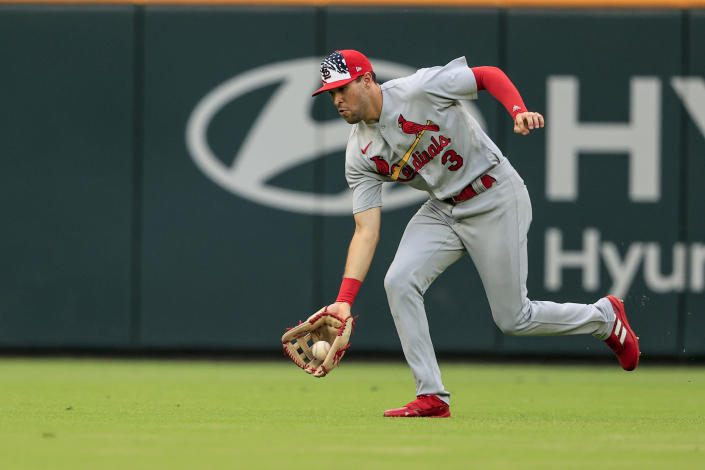 St. Louis Cardinals right fielder Dylan Carlson fields the ball on a hit by Atlanta Braves' Phil Gosselin during the third inning of a baseball game Monday, July 4, 2022, in Atlanta. (AP Photo/Butch Dill)