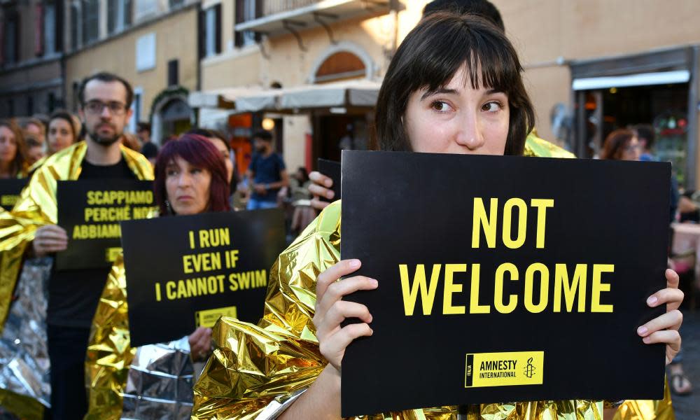 Amnesty International activists in Rome call for protection of asylum seekers on World Refugee Day last week.