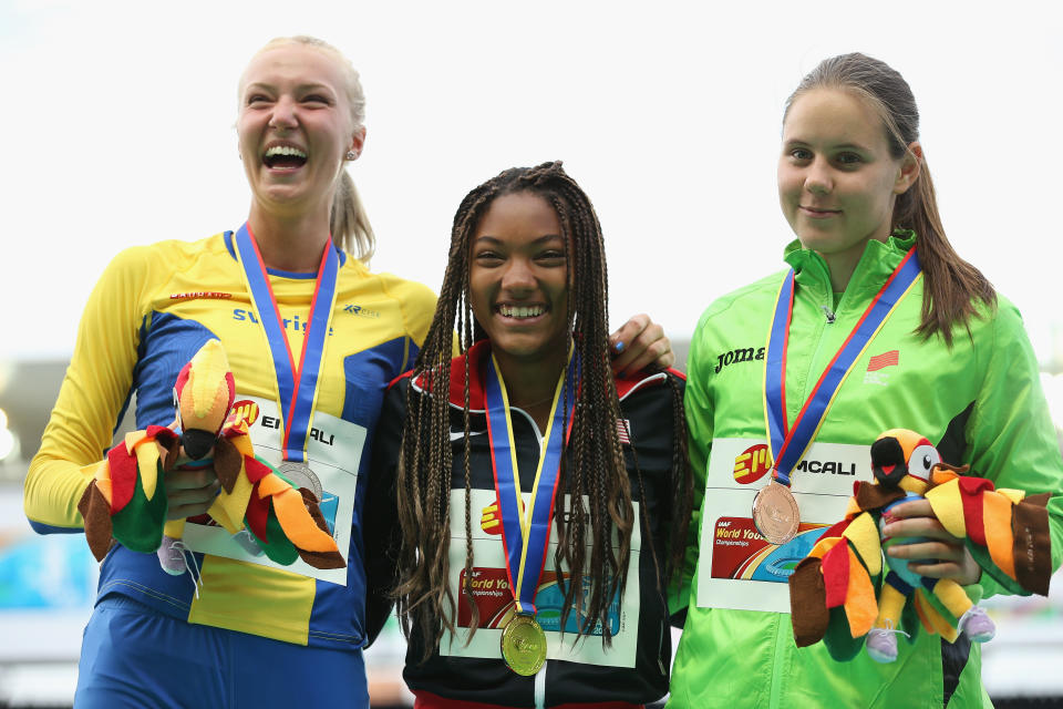 <p>Tara Davis of the USA, gold medal, Kaiza Karlen of Sweden, silver medal, and Maja Bedrac of Slovenia, bronze medal, celebrate on the podium after the Girls Long Jump Final on day five of the IAAF World Youth Championships, Cali 2015 on July 19, 2015 at the Pascual Guerrero Olympic Stadium in Cali, Colombia. (Photo by Patrick Smith/Getty Images for IAAF)</p> 