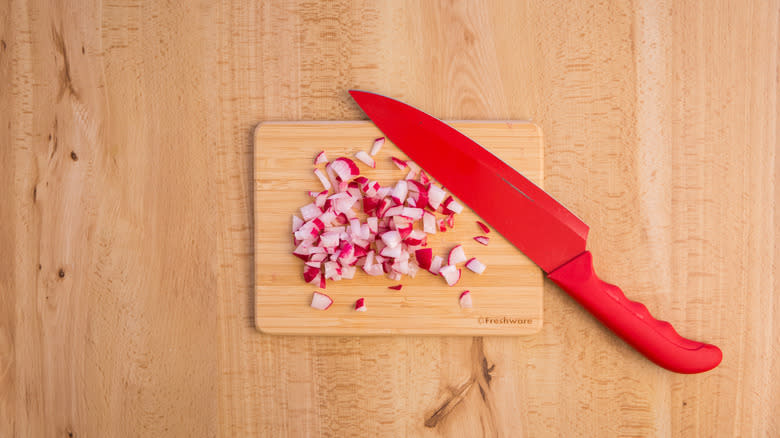 chopped radishes on cutting board