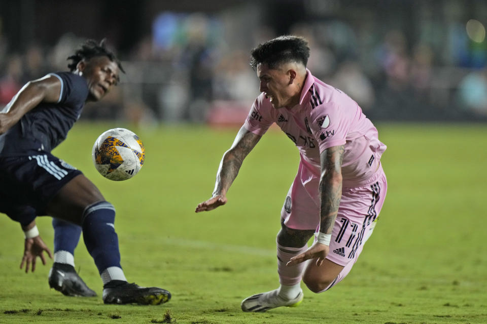 against Inter Miami midfielder Facundo Farias, right, goes down as Sporting Kansas City defender Dany Rosero steals the ball, Saturday, Sept. 9, 2023, during the first half of an MLS soccer match in Fort Lauderdale, Fla. (AP Photo/Wilfredo Lee)