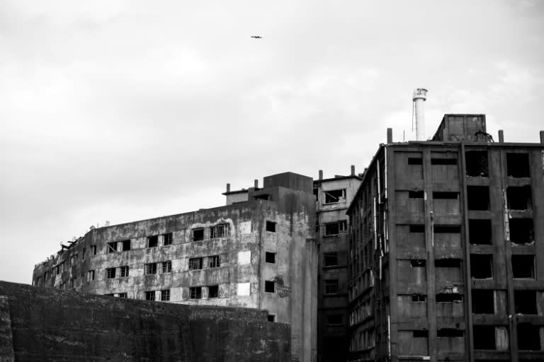 Hashima island was a a dense labyrinth of buildings, packed with a school, swimming pool, open-air market, a hospital, small prison, and rooftop vegetable gardens