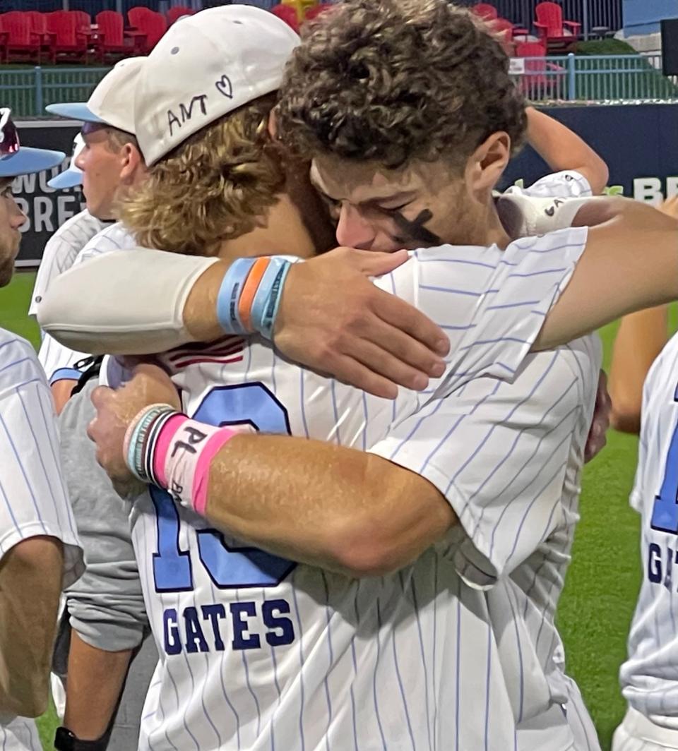 Franklin's Jase Lyons, right, hugs teammate Ben Jarosz after the Panthers fell to Taunton in Sunday's state championship game at Polar Park.
