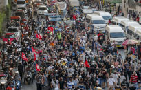 Anti-government protesters march to the criminal court during a protest in Bangkok, Thailand, Saturday, March 6, 2021. A new faction of Thailand's student-led anti-government movement calling itself REDEM, short for Restart Democracy, announced plans to march to Bangkok's Criminal Court Saturday to highlight the plight of several detained leaders of the protest movement. (AP Photo/Sakchai Lalit)