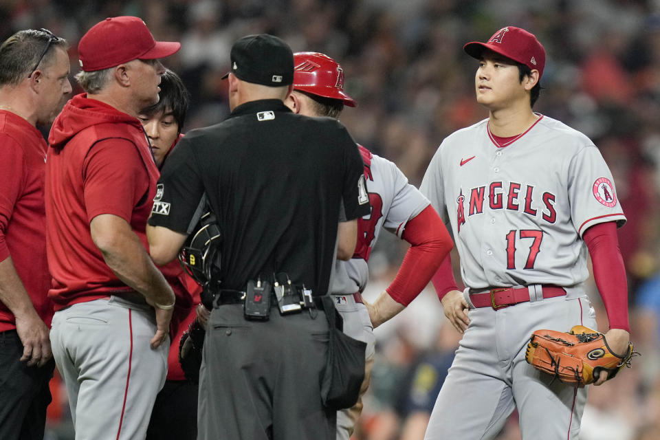 Los Angeles Angels starting pitcher Shohei Ohtani (17) is removed from the baseball game during the sixth inning of the team's game against the Houston Astros Saturday, Sept. 10, 2022, in Houston. (AP Photo/Eric Christian Smith)