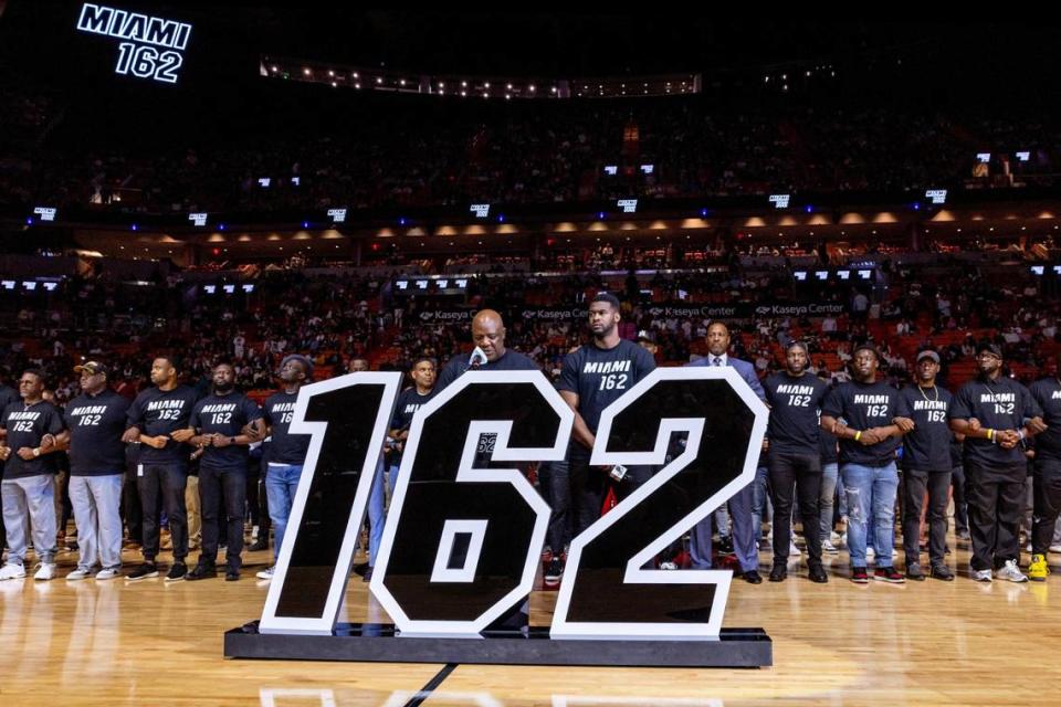 More than 162 Black men stand on the court to represent the 162 Black men that voted to incorporate the City of Miami in 1896 during a halftime show during an NBA game at Kaseya Center in Miami, Florida, on Wednesday, February 7, 2024.