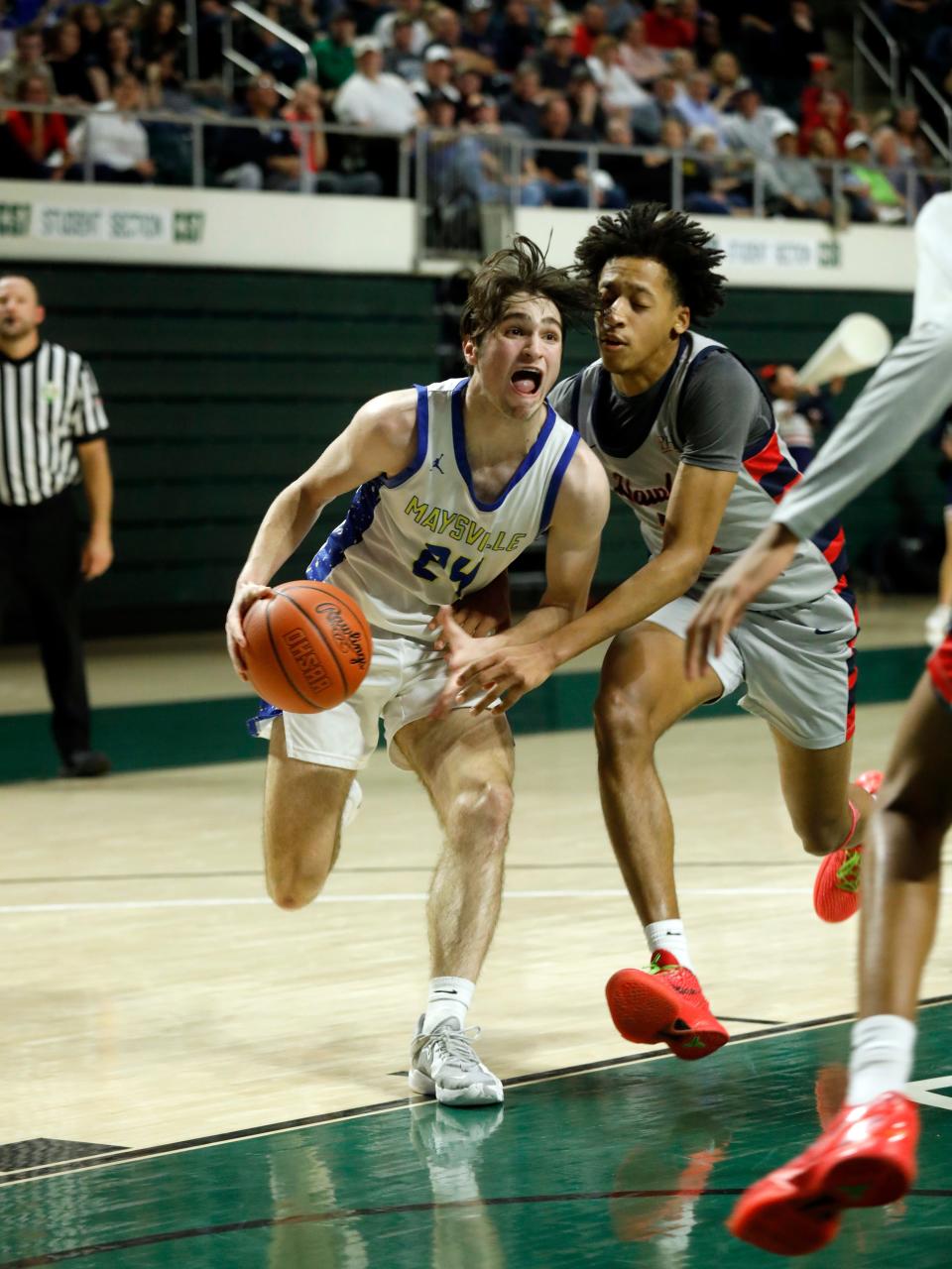 Sophomore Jordyn Watson drives into the lane during Maysville's 50-49 win against Columbus Hartley during a Division II regional semifinal on Thursday at the Ohio Convocation Center. Watson scored all 18 of his points in the second half as Maysville won its first regional game since 1971.