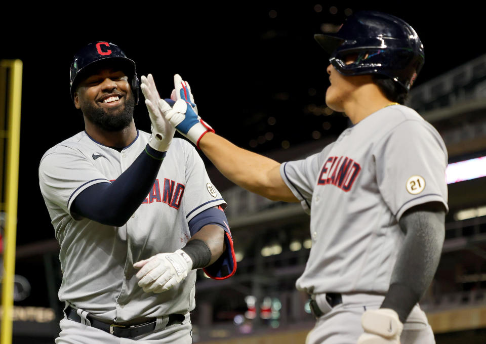 MINNEAPOLIS, MINNESOTA - SEPTEMBER 15: Franmil Reyes #32 of the Cleveland Indians celebrates his home run with Yu Chang #2 in the ninth inning against the Minnesota Twins at Target Field on September 15, 2021 in Minneapolis, Minnesota. The Cleveland Indians defeated the Minnesota Twins 12-3. (Photo by Adam Bettcher/Getty Images)