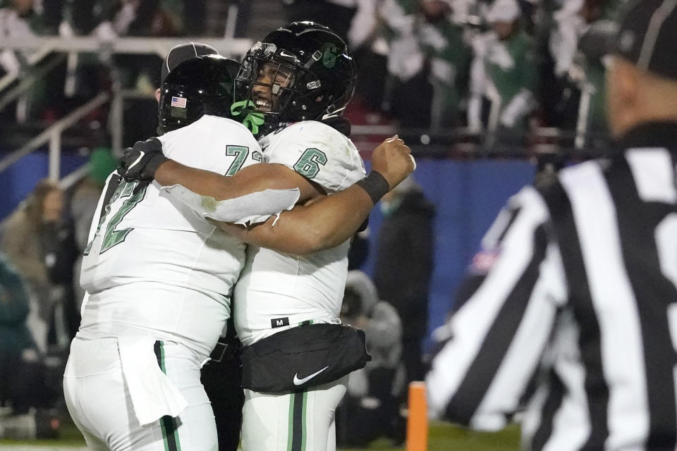 North Texas running back Ikaika Ragsdale (6) celebrates his touchdown with teammate offensive lineman Manase Mose (72) during the first half of the Frisco Bowl NCAA college football game against Boise State Saturday, Dec. 17, 2022, in Frisco, Texas. (AP Photo/LM Otero)
