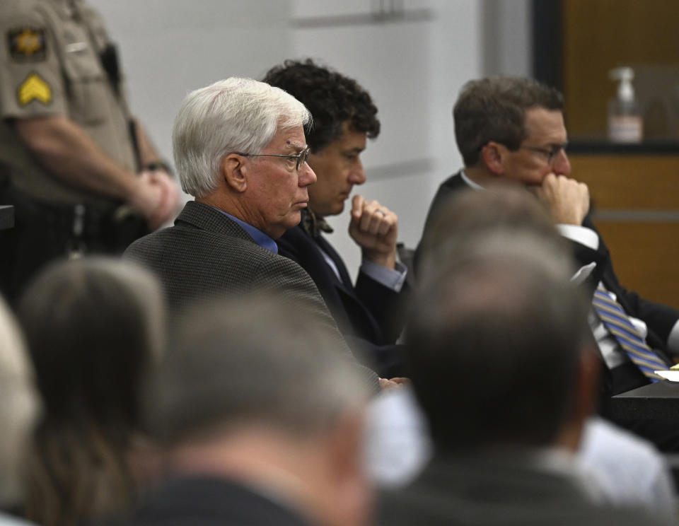 Thomas Martens, left, sits with attorneys Jones Byrd, center, and Jay Vannoy, right, during a hearing, Monday, Oct. 30, 2023, for Martens and his daughter, Molly Corbett, in the 2015 death of Molly's husband, Jason Corbett at the Davidson County Courthouse in Lexington, N.C. (Walt Unks/The Winston-Salem Journal via AP, Pool)