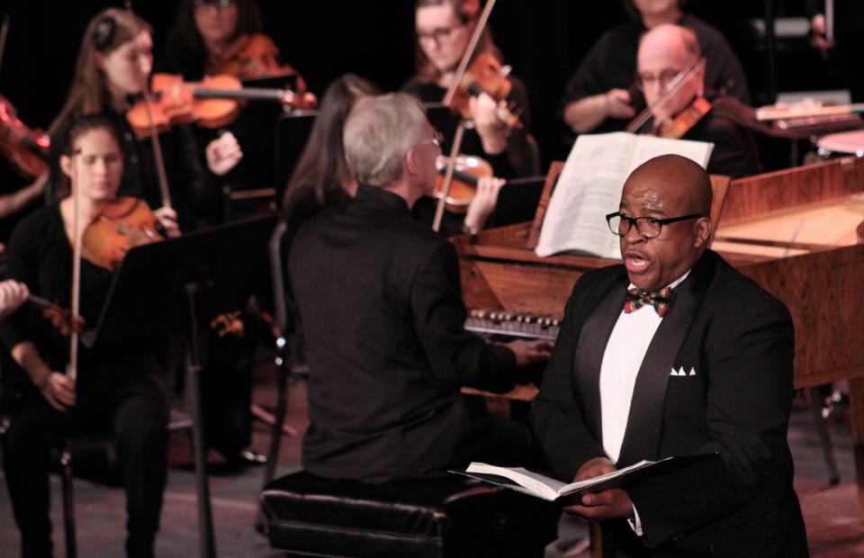 Samuel Cook, artist in residence, opera director and professor of voice at Abilene Christian University, sings his tenor part of Abilene Opera Association's presentation of Handel's "Messiah" in 2019 at the Paramount Theatre. At the harpsichord, center, is conductor David Itkin, also music director of the Abilene Philharmonic Orchestra. This year's presentation is Sunday.