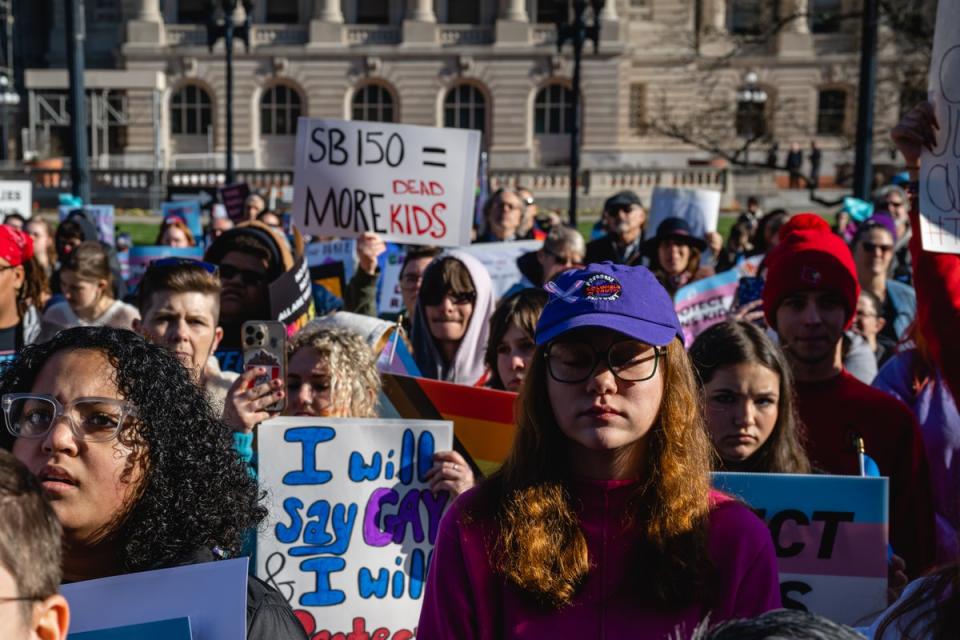 Protesters outside Kentucky’s state capitol in Frankfort demonstrate against a bill targeting trans children as Republican lawmakers voted to override Governor Andy Beshear’s veto on 29 March (Getty Images)