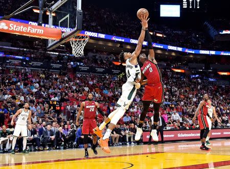 Mar 15, 2019; Miami, FL, USA; Milwaukee Bucks forward Giannis Antetokounmpo (34) and Miami Heat guard Josh Richardson (0) both reach for a rebound during the second half at American Airlines Arena. Mandatory Credit: Steve Mitchell-USA TODAY Sports
