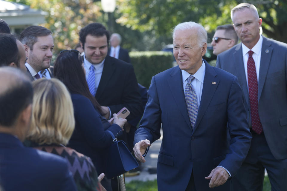 President Joe Biden greets people in the Rose Garden of the White House in Washington, Wednesday, Oct. 11, 2023, after speaking about efforts to eliminate hidden junk fees. The Federal Trade Commission on Wednesday proposed a rule to ban any hidden and bogus junk fees, which can mask the total cost of concert tickets, hotel rooms and utility bills. (AP Photo/Susan Walsh)