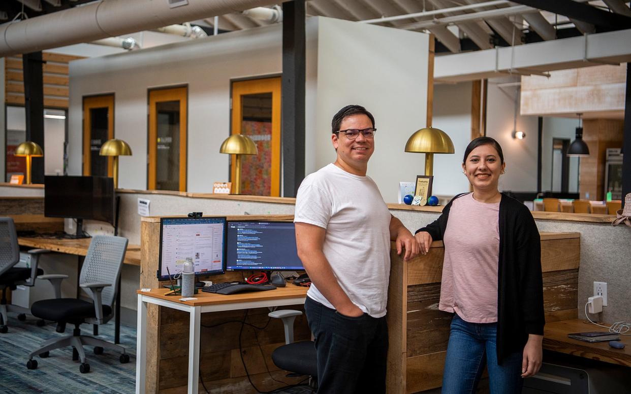 Diego Achio, left, and Cynthia Herrera pose inside The Mill on Tuesday, Aug. 15, 2023. They founded Traduality, a digital marketplace for businesses to connect with freelance language translators.