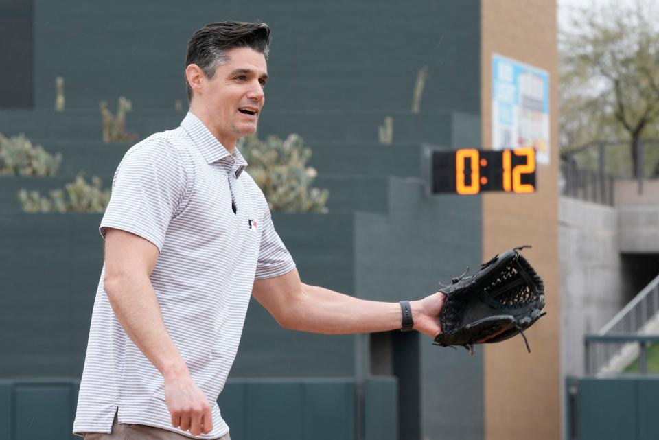 Major League Baseball Vice President of On-Field Strategy Joe Martinez demonstrates some of the new rule changes for the 2023 season.