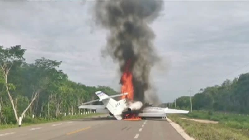 Video grab of a plane suspected of carrying drugs that was reportedly set alight after allegedly being intercepted by soldiers on Federal Highway 184 in Quintana Roo state, Mexico