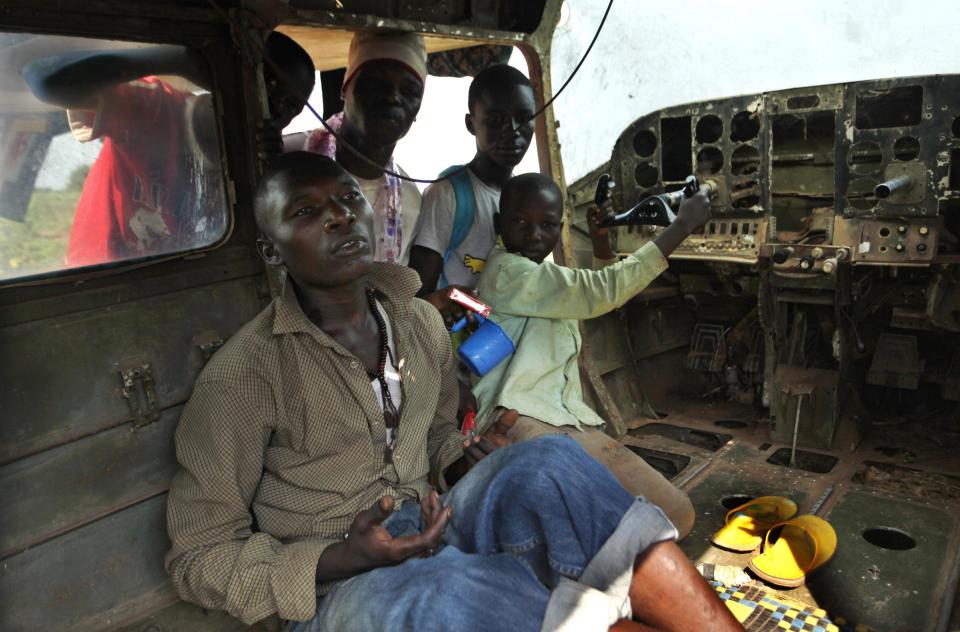 Displaced people are seen inside a plane in Bangui December 12, 2013. Religious leaders sought reconciliation between Muslims and Christians in Central African Republic on Wednesday during a lull in violence that has killed hundreds of people and drawn in French troops seeking to stop the bloodshed. Medical charity Medical Charity Medecins Sans Frontieres said that an improvised centre for more than 20,000 displaced people at Bangui airport was lacking food, shelter and toilets. REUTERS/Emmanuel Braun (CENTRAL AFRICAN REPUBLIC - Tags: POLITICS CIVIL UNREST CONFLICT)