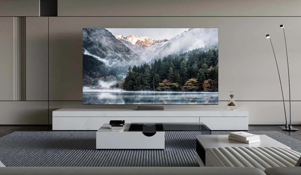 Samsung TV in the living room with mountain and tree landscape on the screen