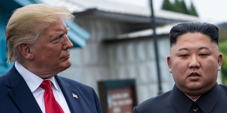 US President Donald Trump and North Korea's leader Kim Jong-un talk before a meeting in the Demilitarized Zone (DMZ) on June 30, 2019, in Panmunjom, Korea.