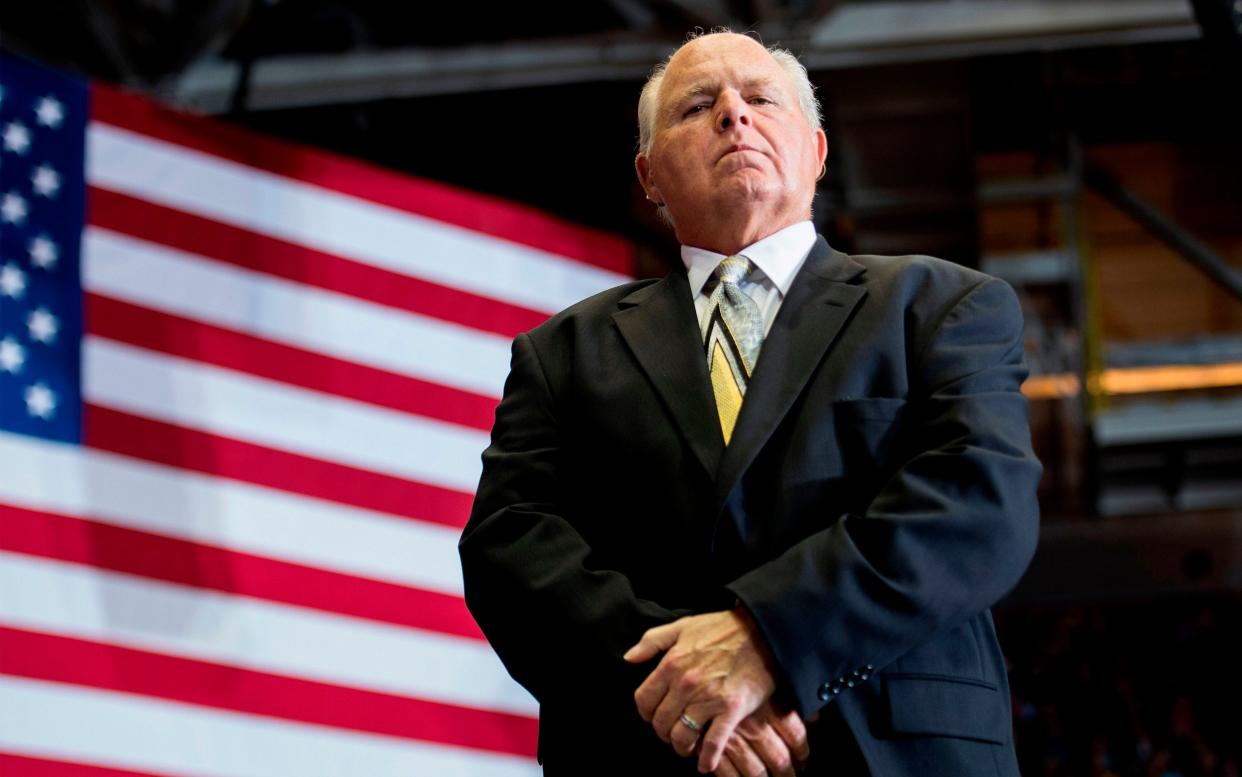 US radio talk show host and conservative political commentator Rush Limbaugh looks on before introducing US President Donald Trump to deliver remarks at a Make America Great Again rally in Cape Girardeau - Jim Watson/AFP