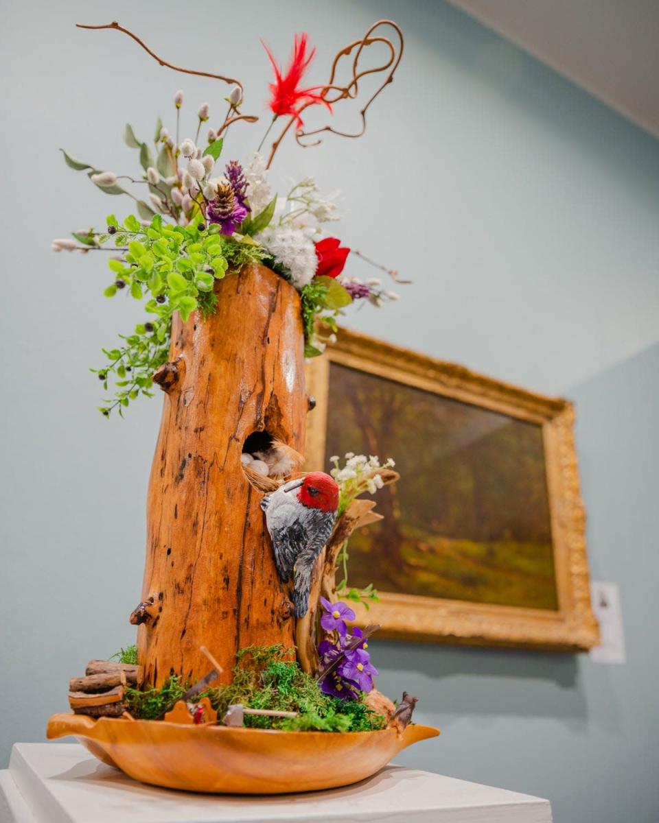 Virginia Morrow&#39;s floral arrangement, based on George Inness&#39; 1865 oil painting &quot;The Woodchopper,&quot; received the Springfield Art Museum&#39;s Art In Bloom People&#39;s Choice Award this May. Morrow&#39;s arrangement was one of 22 entered into this year&#39;s three-day art and flower festival. The festival included an opening night nature-inspired runway and floral arrangement workshops.