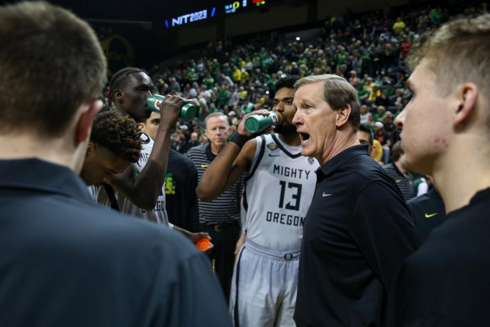 Oregon head coach Dana Altman talks to his players as the Oregon Ducks host Wisconsin in the quarterfinal round of the NIT Tuesday, March 21, 2023 at Matthew Knight Arena in Eugene, Ore.