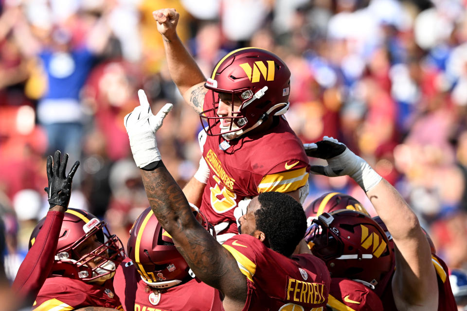 Austin Seibert #3 of the Washington Commanders celebrates with teammates after kicking the game-winning field goal to beat the New York Giants 21-18 at Northwest Stadium on September 15, 2024 in Landover, Maryland. (Photo by Greg Fiume/Getty Images)