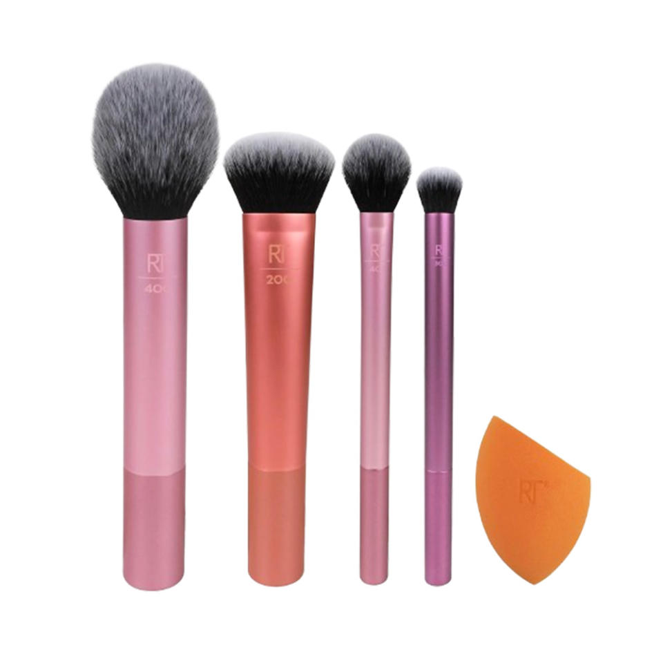 makeup brush set with an orange sponge