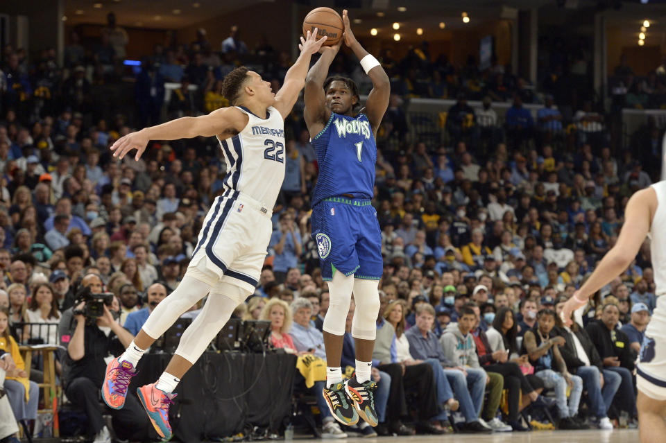 Minnesota Timberwolves forward Anthony Edwards (1) shoots against Memphis Grizzlies guard Desmond Bane (22) in the second half of Game 1 of a first-round NBA basketball playoff series Saturday, April 16, 2022, in Memphis, Tenn. (AP Photo/Brandon Dill)