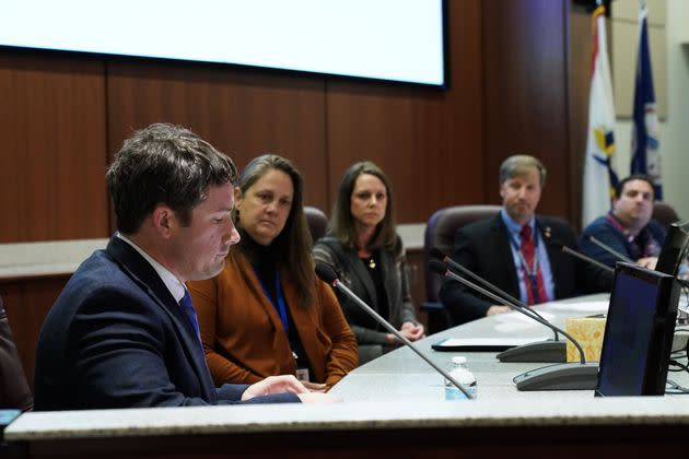 Dr. Daniel Smith, left, takes his place on the board after being appointed interim superintendent of Loudoun County Public Schools at an emergency board meeting at LCPS Administrative Offices on Dec. 8, 2022, in Ashburn.