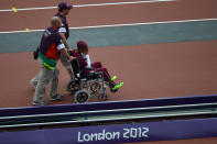 Qatar's Noor Hussain Al-Malki leaves the field on a wheelchair after suffering an injury in the women's 100m heats at the athletics event during the London 2012 Olympic Games on August 3, 2012 in London. AFP PHOTO / JEWEL SAMADJEWEL SAMAD/AFP/GettyImages