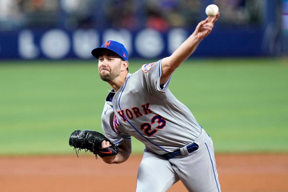 New York Mets starting pitcher David Peterson (23) throws during the second inning of a baseball game against the Miami Marlins, Sunday, June 26, 2022, in Miami.