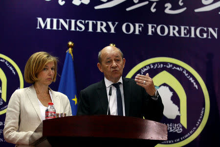 French Foreign Minister Jean-Yves Le Drian (R) and French Defence Minister Florence Parly (L) speak during a news conference in Baghdad, Iraq August 26, 2017. REUTERS/Khalid al Mousily